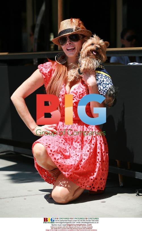 Phoebe Price Feeds Yorkie in Beverly Hills