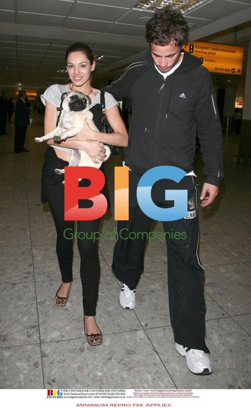 Kelly Brook Arrives at Heathrow