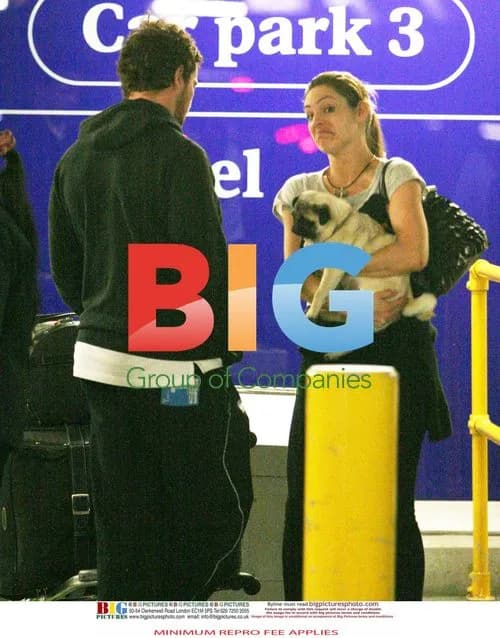 Kelly Brook Arrives at Heathrow
