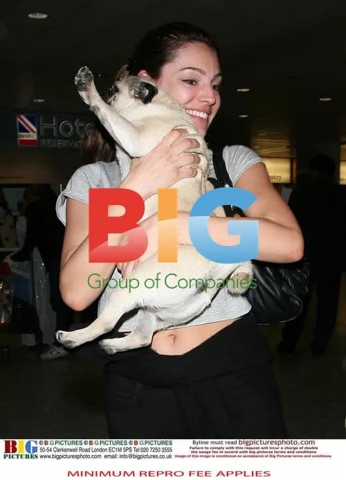 Kelly Brook Reunites with Boyfriend at Airport