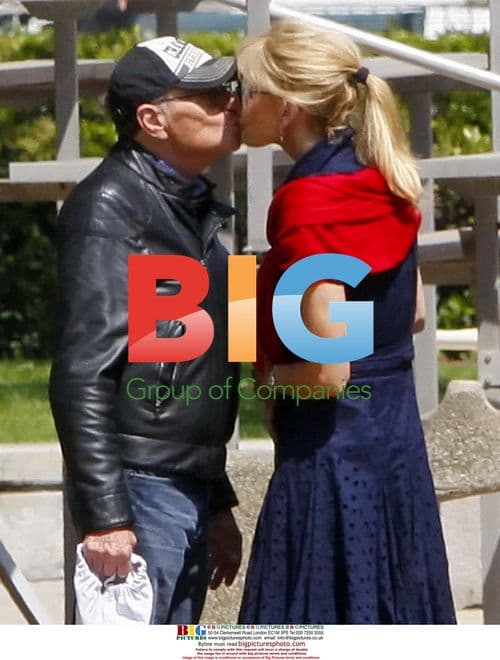 Larry King and Shawn Southwick play catch with sons