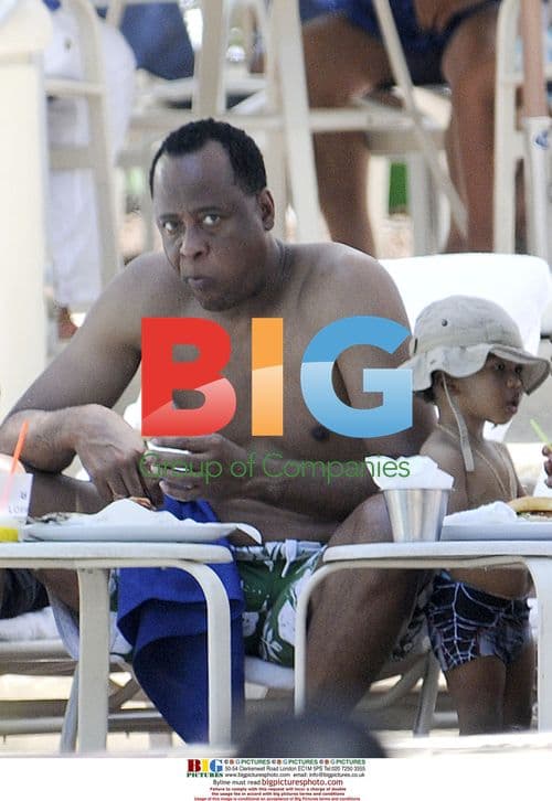Conrad Murray and Family Poolside in Miami