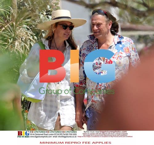 Jerry Hall with mystery boyfriend on beach