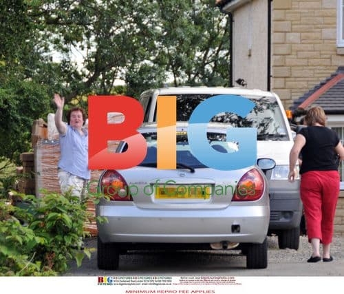 Susan Boyle with workmen at new home