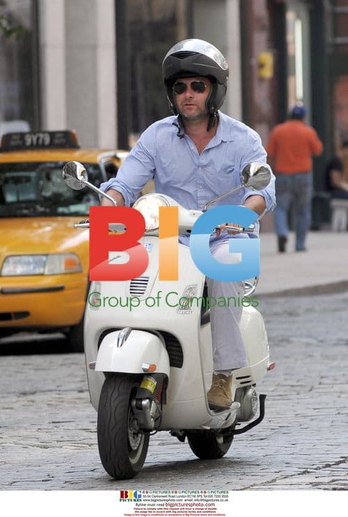 Liev Schreiber riding Vespa in Soho, NYC