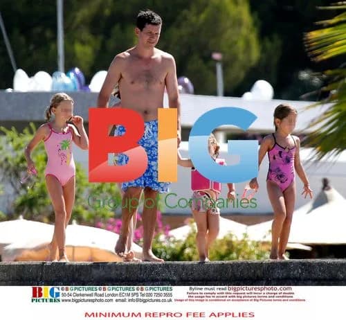 Tim Henman Relaxes on Beach in France