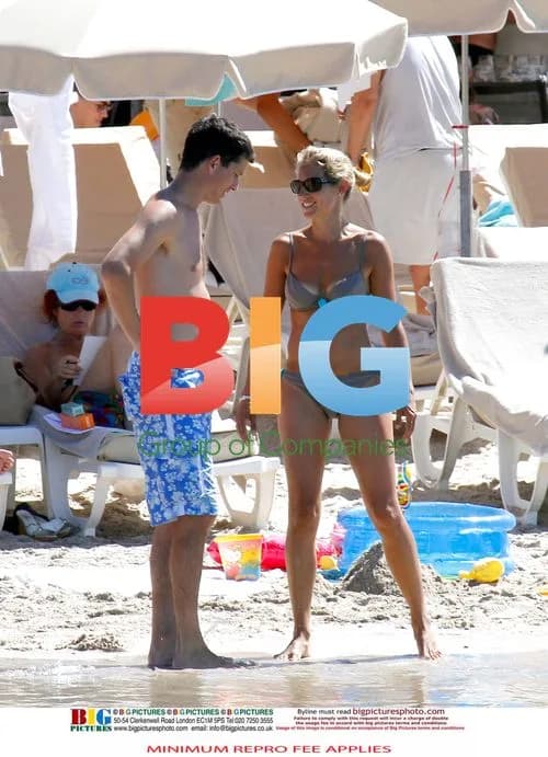 Tim Henman Enjoys Beach with Family