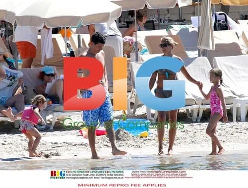 Tim Henman with family at beach in France