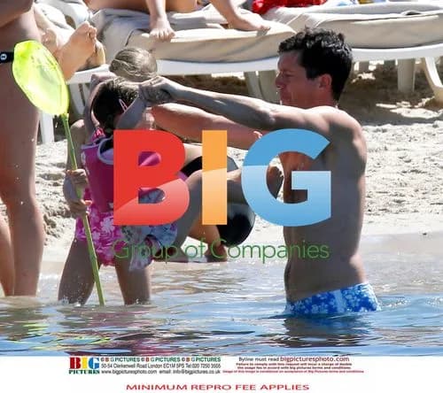 Tim Henman at the beach with family