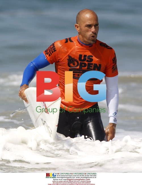 Kelly Slater competes in US Open of Surfing quarterfinals