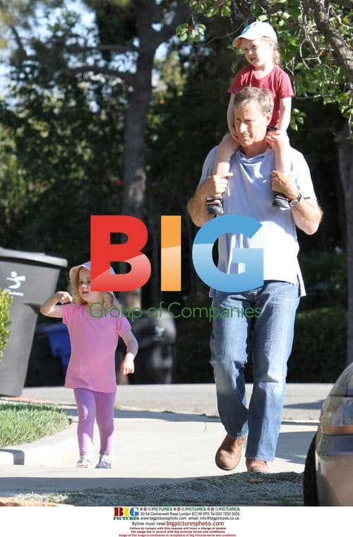 Marcia Cross' Twins Take a Walk with Dad