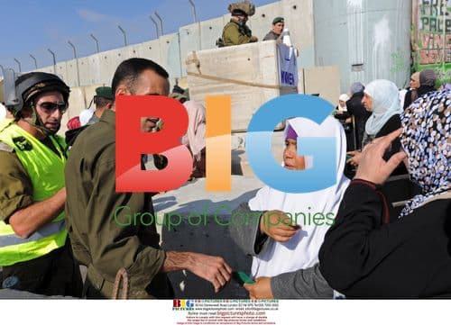 Israeli soldiers and Palestinian police at Qalandia Checkpoint