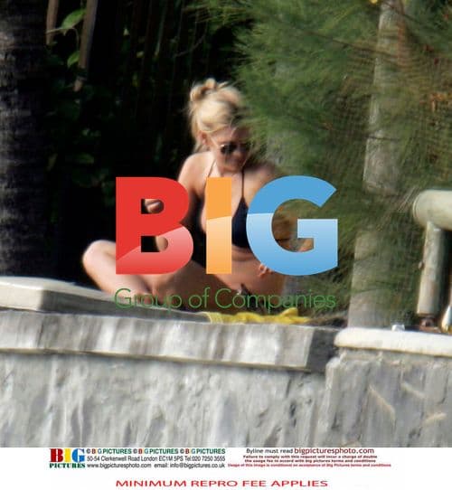 Chelsy Davy Relaxes by the Beach