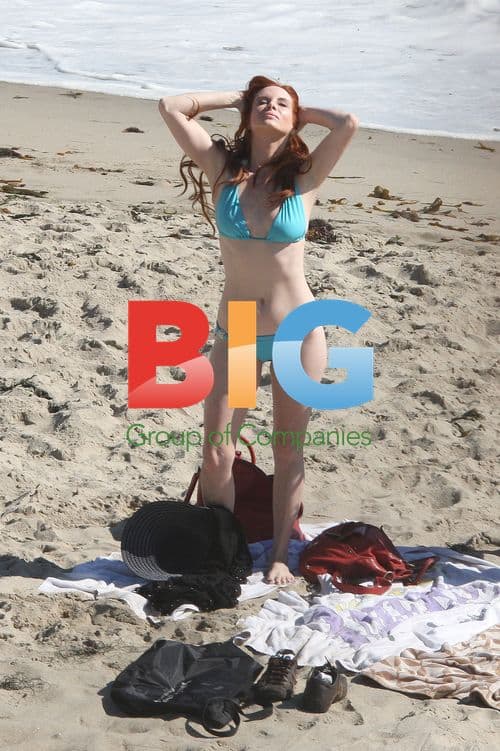Phoebe Price Laughing on Beach in Malibu