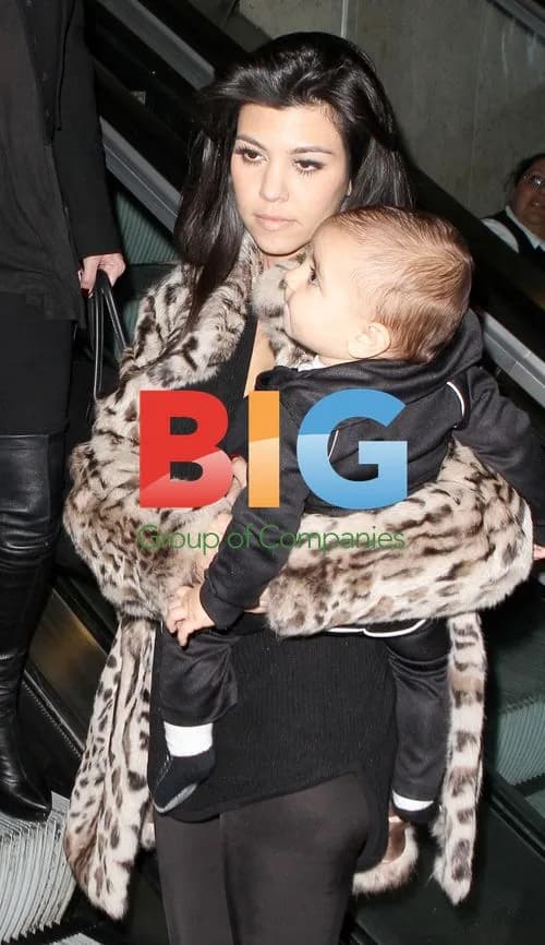 Kardashian Sisters Return to LAX with Baby