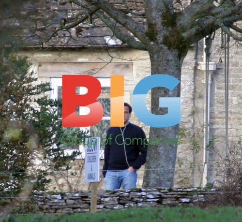 Arun Nayar smoking outside Cotswold home