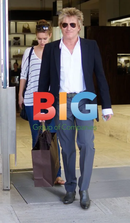 Rod Stewart shops with friend at Gucci
