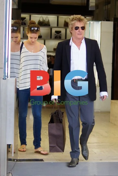 Rod Stewart shops with friend at Gucci