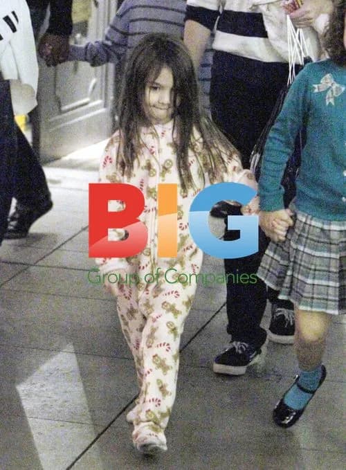 Suri Cruise playing in pajamas