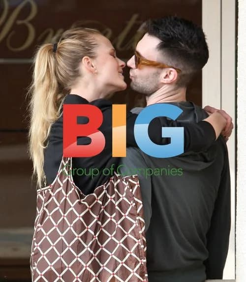 Adam Levine and girlfriend kissing