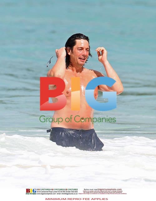 Laurence Llewelyn-Bowen and family on Barbados beach