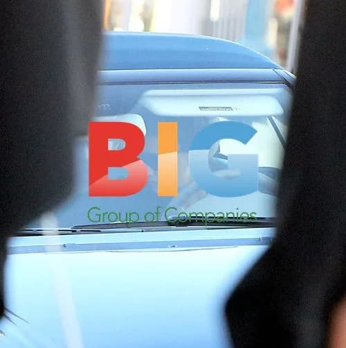 Katie Holmes drives with male passenger