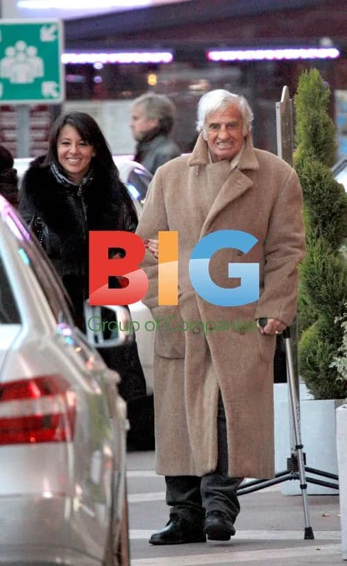 Jean-Paul Belmondo and Barbara Gandolfi arrive at airport in Nice