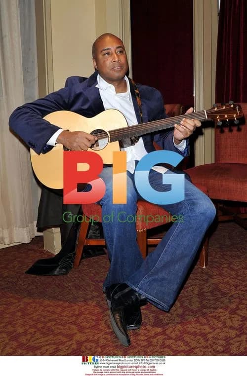Bernie Williams Performs at Bat For The Cure