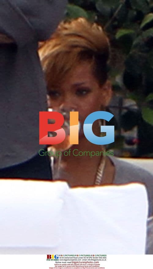 Rihanna Relaxes Poolside With Friends