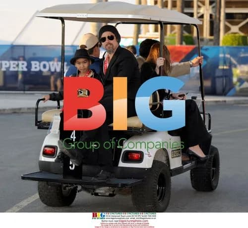 Brad Pitt with son Maddox at Super Bowl XLIV