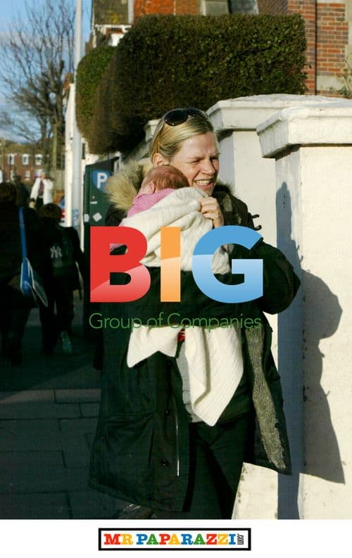 Zoe Ball and baby Nelly pick up son Woody from school