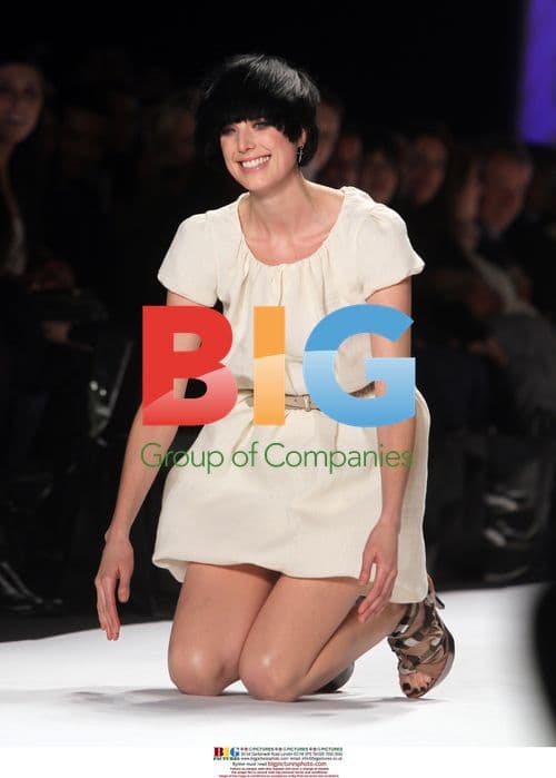 Agyness Deyn Trips at Fashion Show