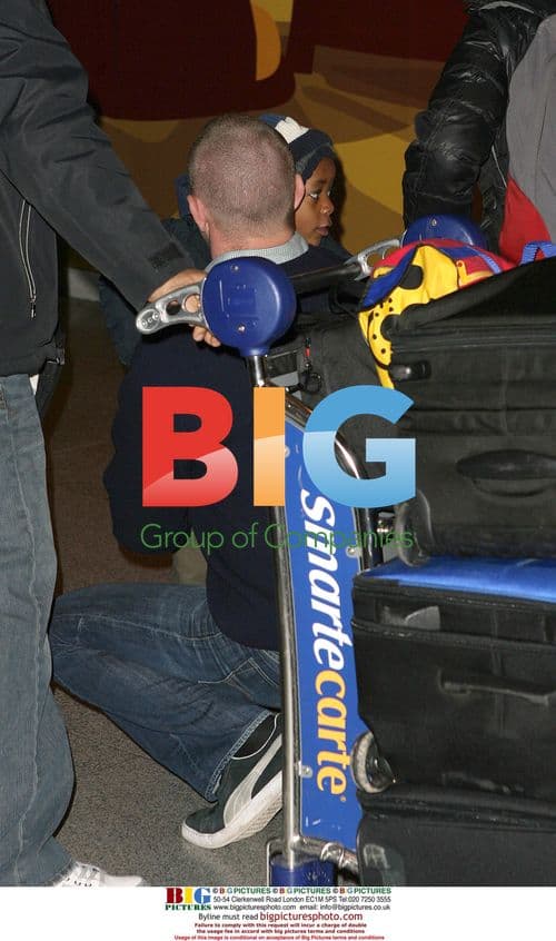 Guy Ritchie with sons at JFK airport