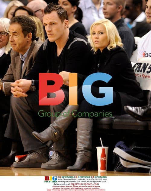 Elisha Cuthbert and Dion Phaneuf at Toronto Raptors Game