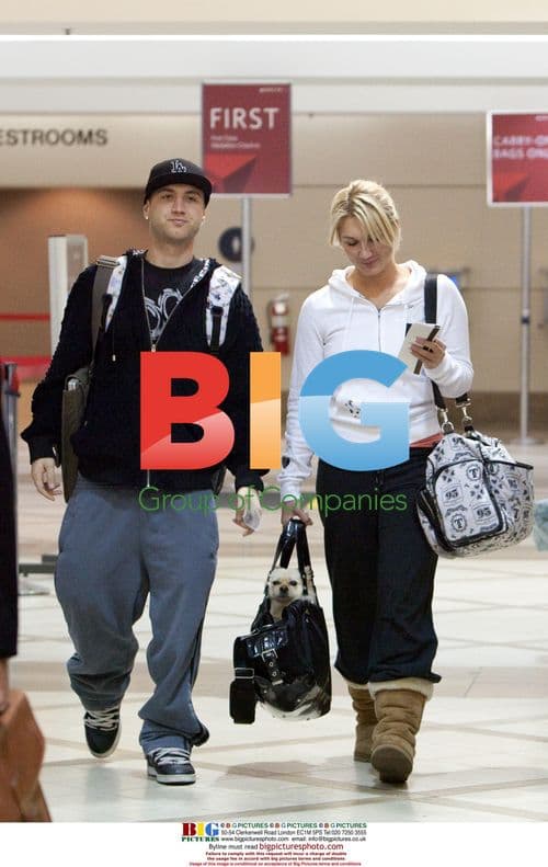Brooke and Nick Hogan make funny faces at LAX