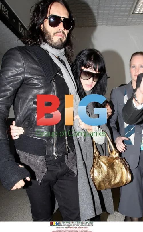 Katy Perry and Russell Brand Arrive at LAX