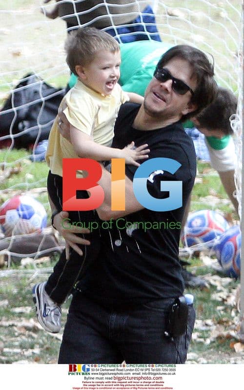 Mark Wahlberg plays with son