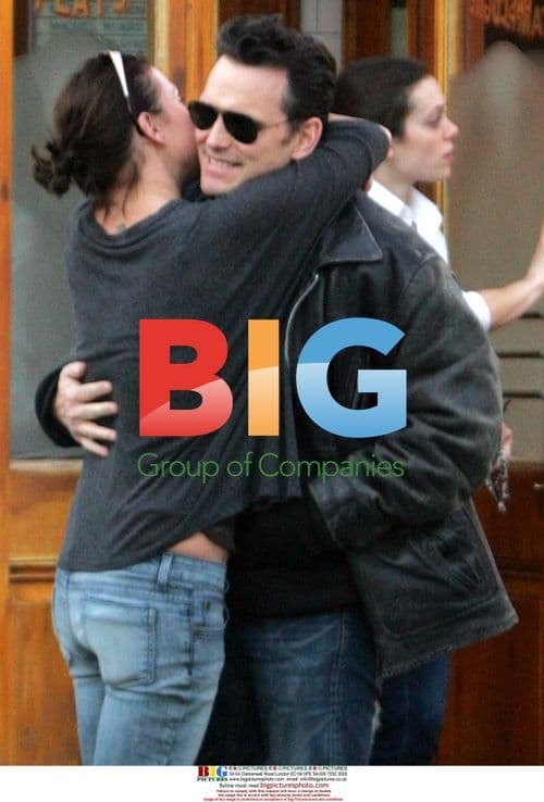 Matt Dillon with woman outside restaurant