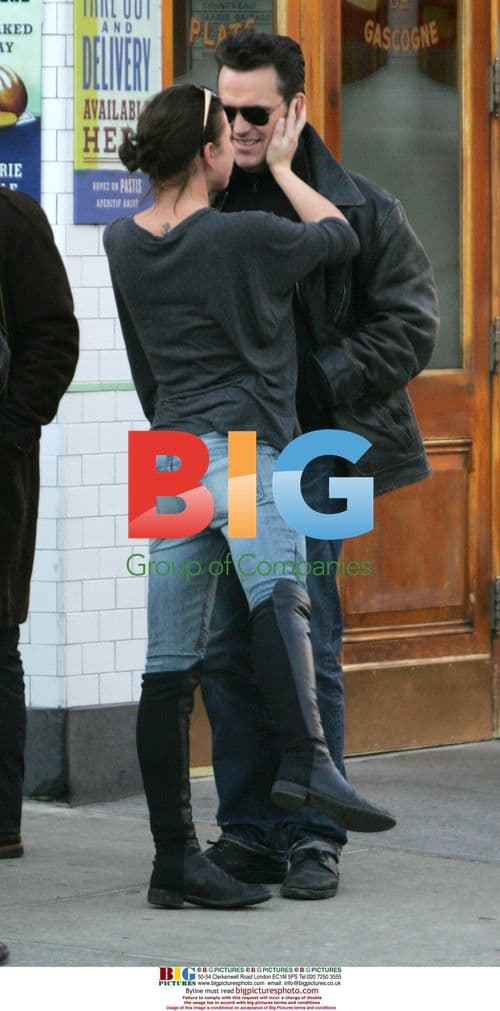 Matt Dillon hugs woman outside Pastis