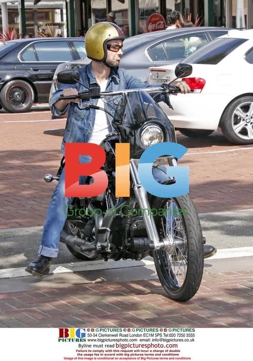 Adam Levine Leaves Cafe Habana on Motorcycle