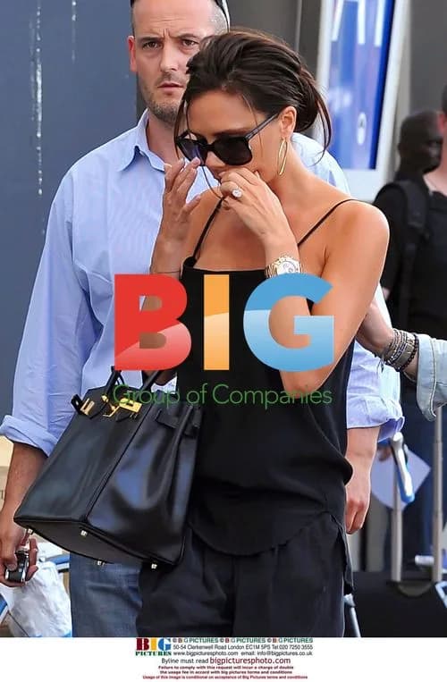 Victoria Beckham Hides Cold Sore at Airport