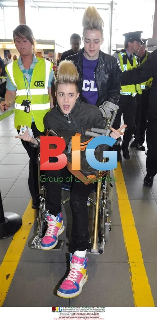 Jedward Arrive at Dublin Airport with Knee Injury