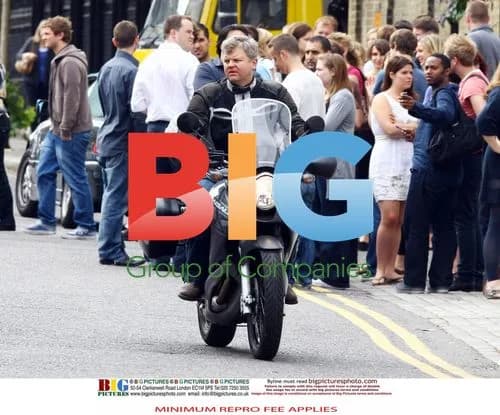 Adrian Chiles rides motorbike without helmet