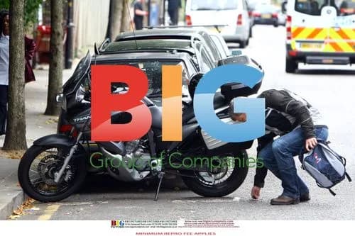Adrian Chiles rides motorcycle without helmet