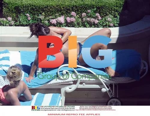 Wayne and Coleen Rooney at poolside with friends