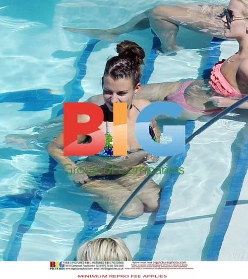 Wayne and Coleen Rooney Poolside