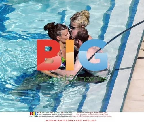 Wayne and Coleen Rooney at pool in USA