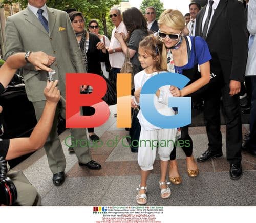 Nicky and Paris Hilton leave hotel in Paris