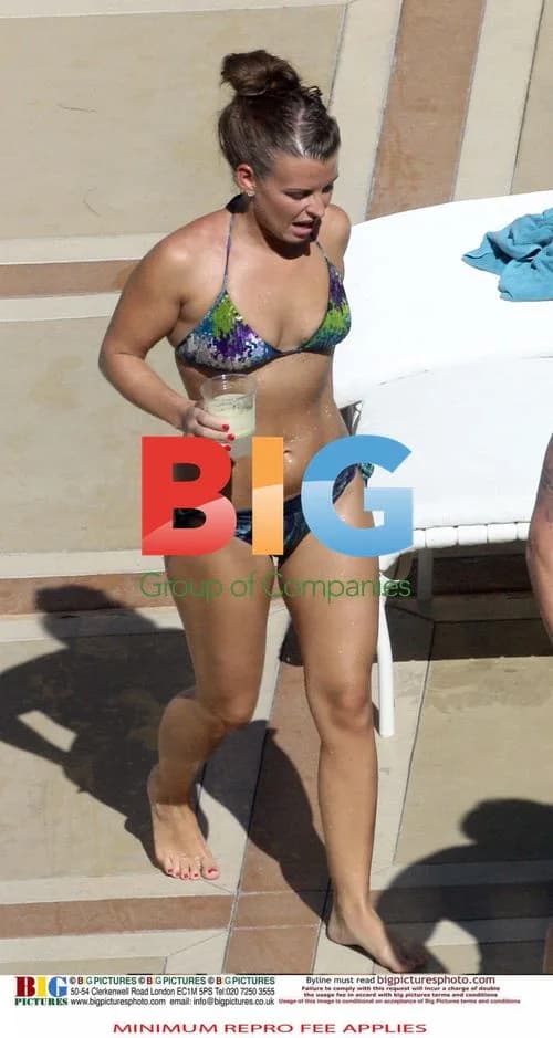 Wayne and Coleen Rooney Relaxing Poolside