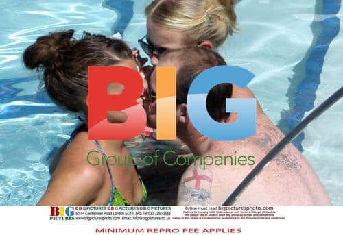 Coleen and Wayne Rooney Relax by Pool